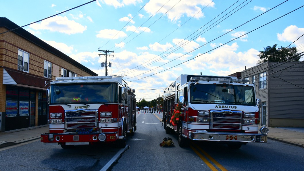 Two Trucks at the Top of the Street