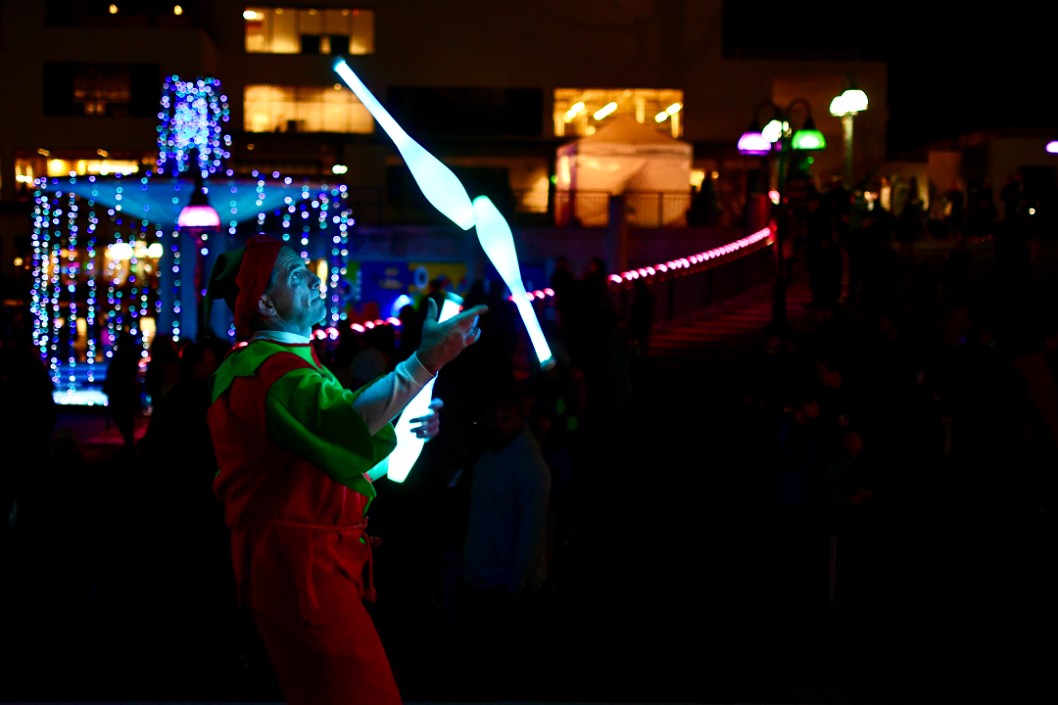 Festive Juggler Gathering the Clubs