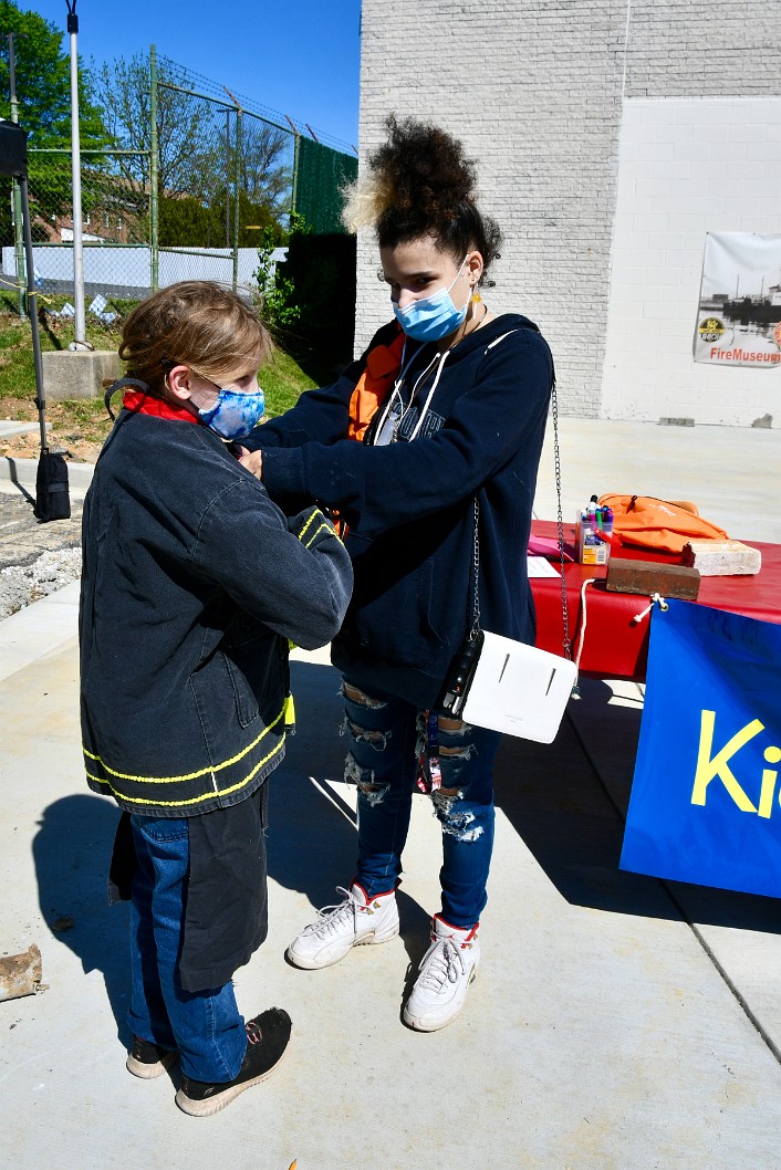 Helping to Outfit a Little Firefighter