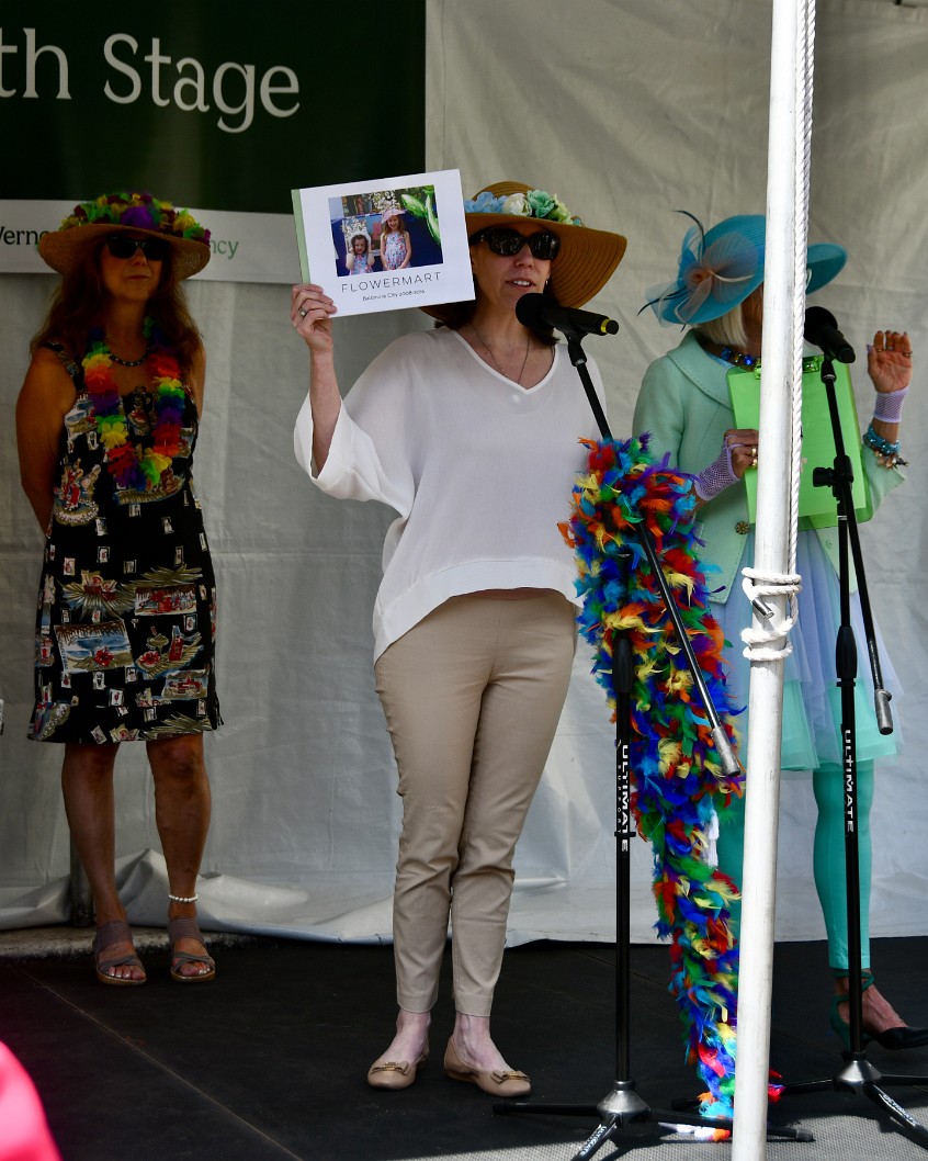 Mrs. April Showing the Awesome Picture Book of Her Familys Flower Marts Past