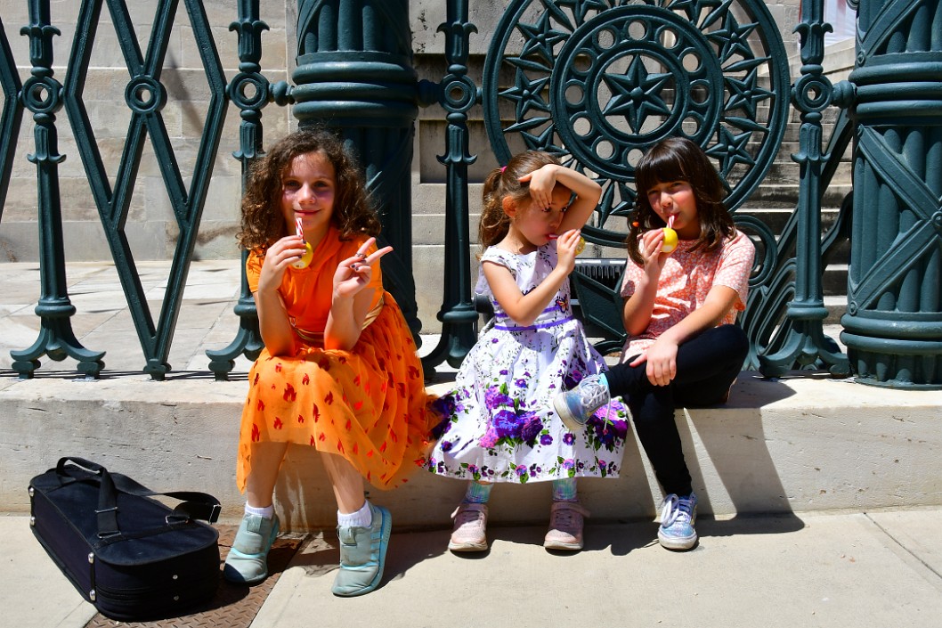 Three Kids Enjoying Lemon Sticks