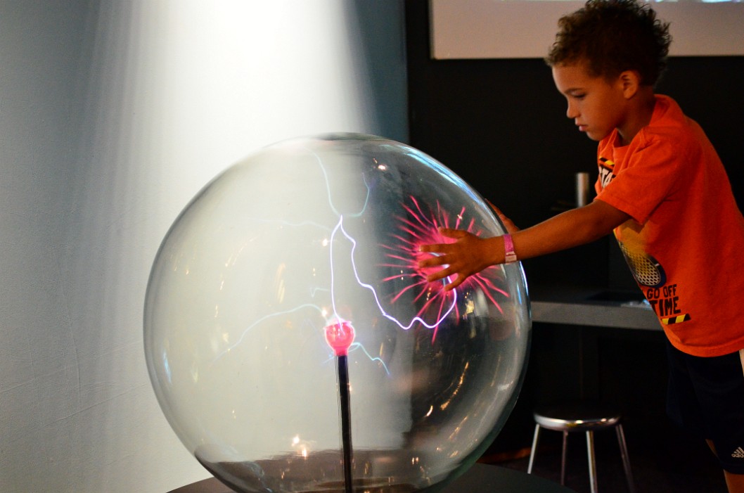 Hand Making a Pink Burst on the Plasma Ball Hand Making a Pink Burst on the Plasma Ball