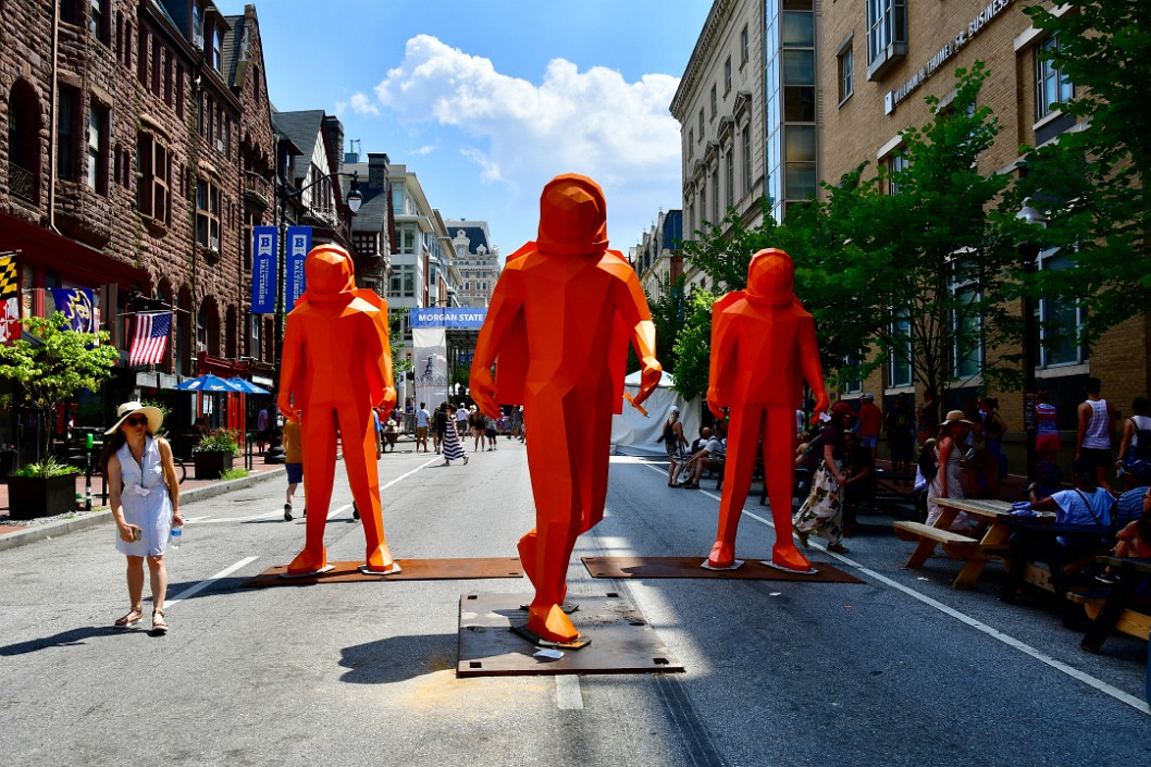Three Orange Sydmonauts in the Street