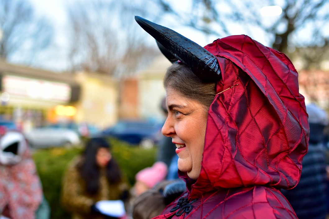 Smiling in Horns and Hood